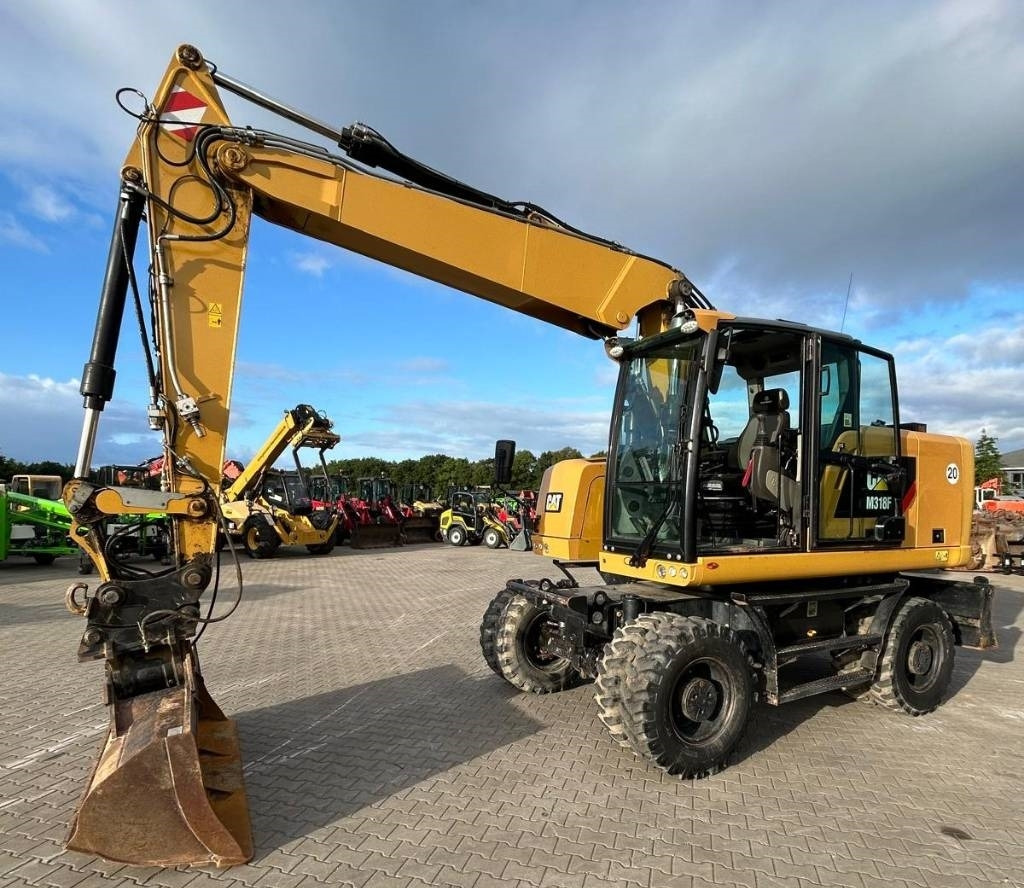 CAT M 318 F - Τροχοφόρος εκσκαφέας: φωτογραφία 1 CAT M 318 F - Τροχοφόρος εκσκαφέας: φωτογραφία 1