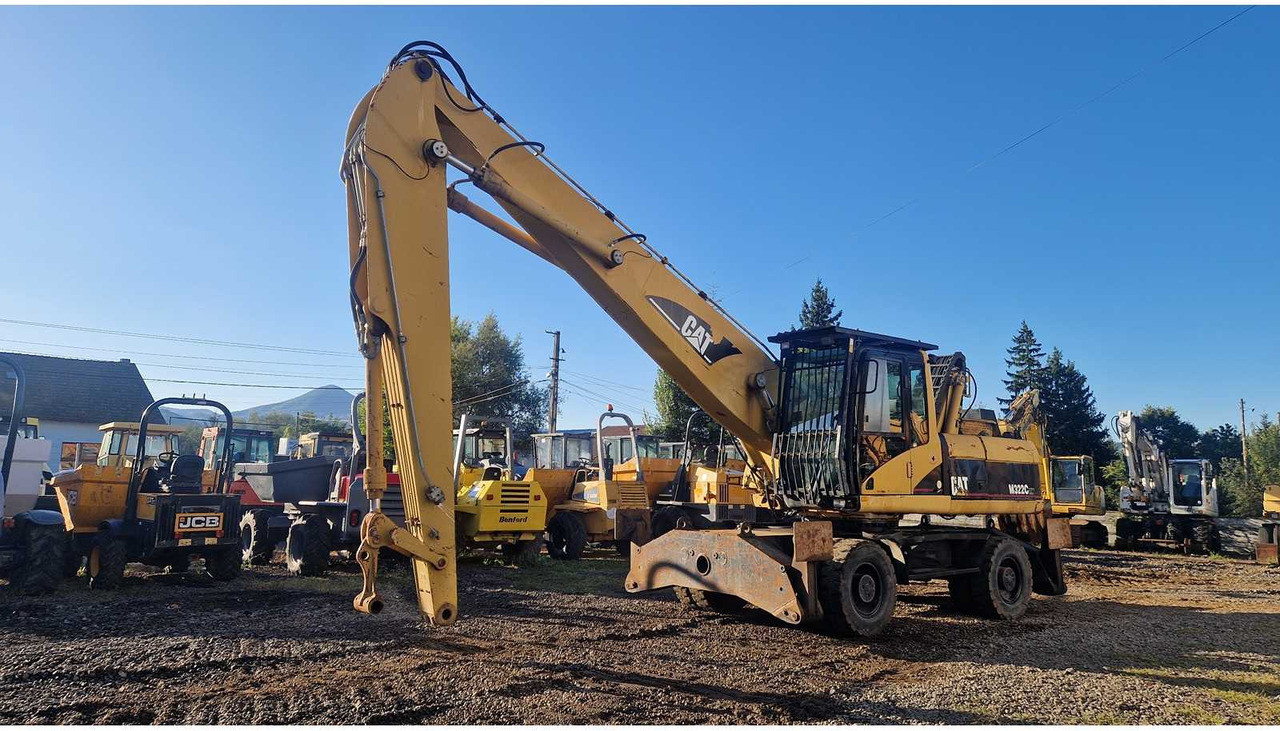 Caterpillar M322C - Τροχοφόρος εκσκαφέας: φωτογραφία 1 Caterpillar M322C - Τροχοφόρος εκσκαφέας: φωτογραφία 1