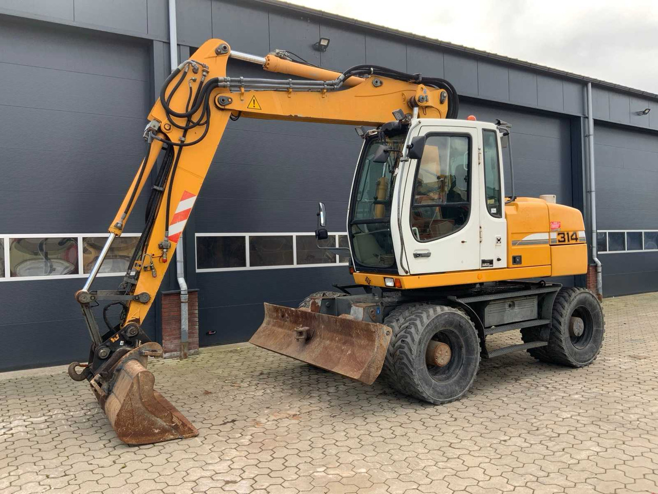 Liebherr A314 Litronic - Τροχοφόρος εκσκαφέας: φωτογραφία 1 Liebherr A314 Litronic - Τροχοφόρος εκσκαφέας: φωτογραφία 1