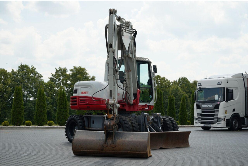 Takeuchi TB 295 W / KOPARKA KOŁOWA / 2016 ROK / PO KONTRAKCIE SERWISOWYM - Τροχοφόρος εκσκαφέας: φωτογραφία 5 Takeuchi TB 295 W / KOPARKA KOŁOWA / 2016 ROK / PO KONTRAKCIE SERWISOWYM - Τροχοφόρος εκσκαφέας: φωτογραφία 5