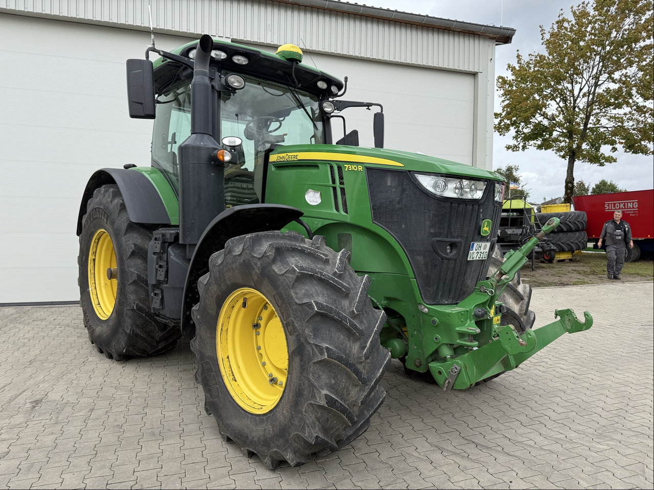 John Deere 7310R E23 - Τρακτέρ: φωτογραφία 1 John Deere 7310R E23 - Τρακτέρ: φωτογραφία 1