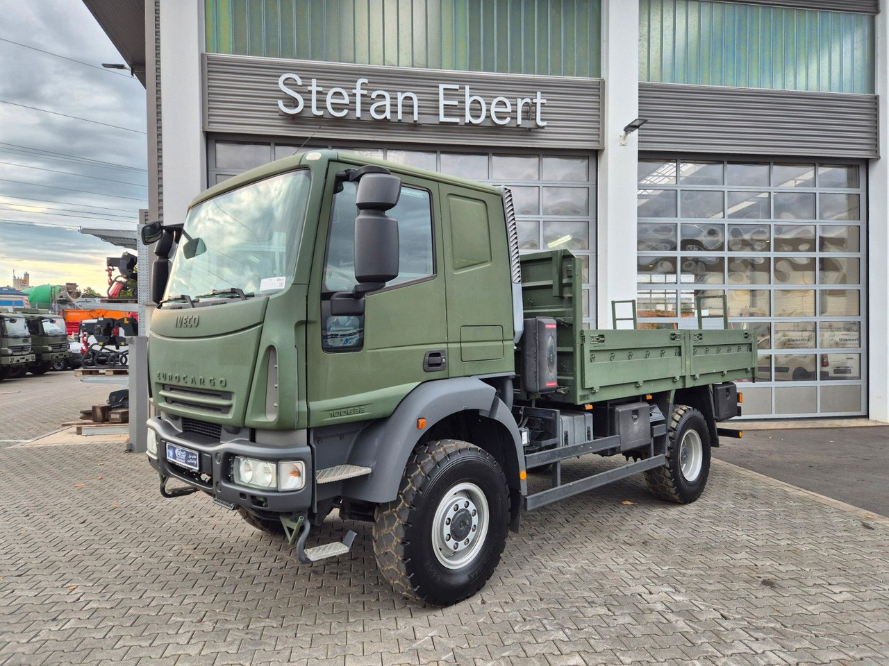 Iveco Eurocargo ML100E22WM-BW 4x4 Pritsche L-Haus Bett - Φορτηγό με ανοιχτή καρότσα: φωτογραφία 3 Iveco Eurocargo ML100E22WM-BW 4x4 Pritsche L-Haus Bett - Φορτηγό με ανοιχτή καρότσα: φωτογραφία 3