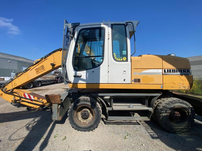 Liebherr A316Litronic - Τροχοφόρος εκσκαφέας: φωτογραφία 1 Liebherr A316Litronic - Τροχοφόρος εκσκαφέας: φωτογραφία 1